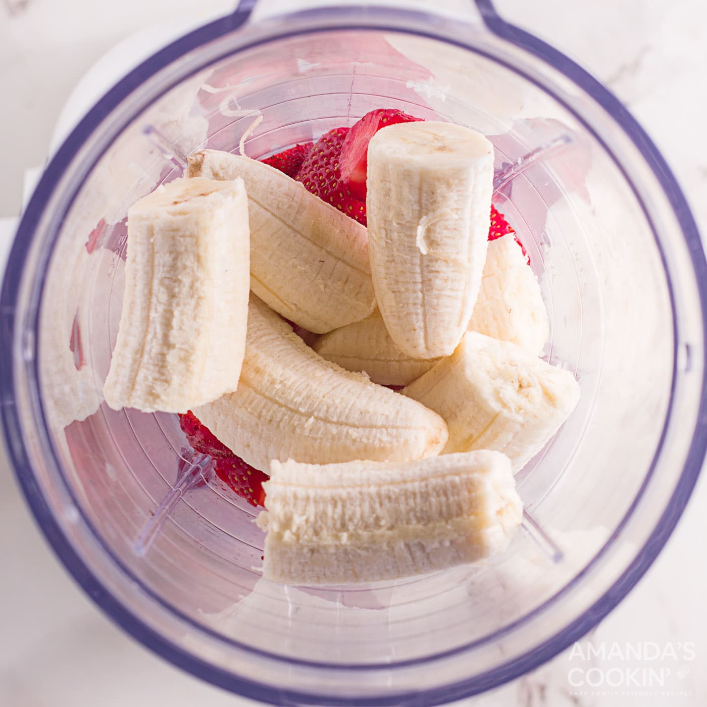 bananas in a blender with strawberries