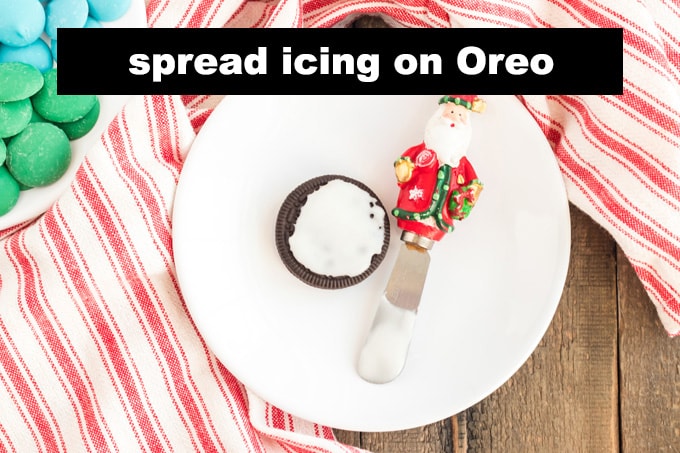 powdered sugar glaze spread on an oreo cookie