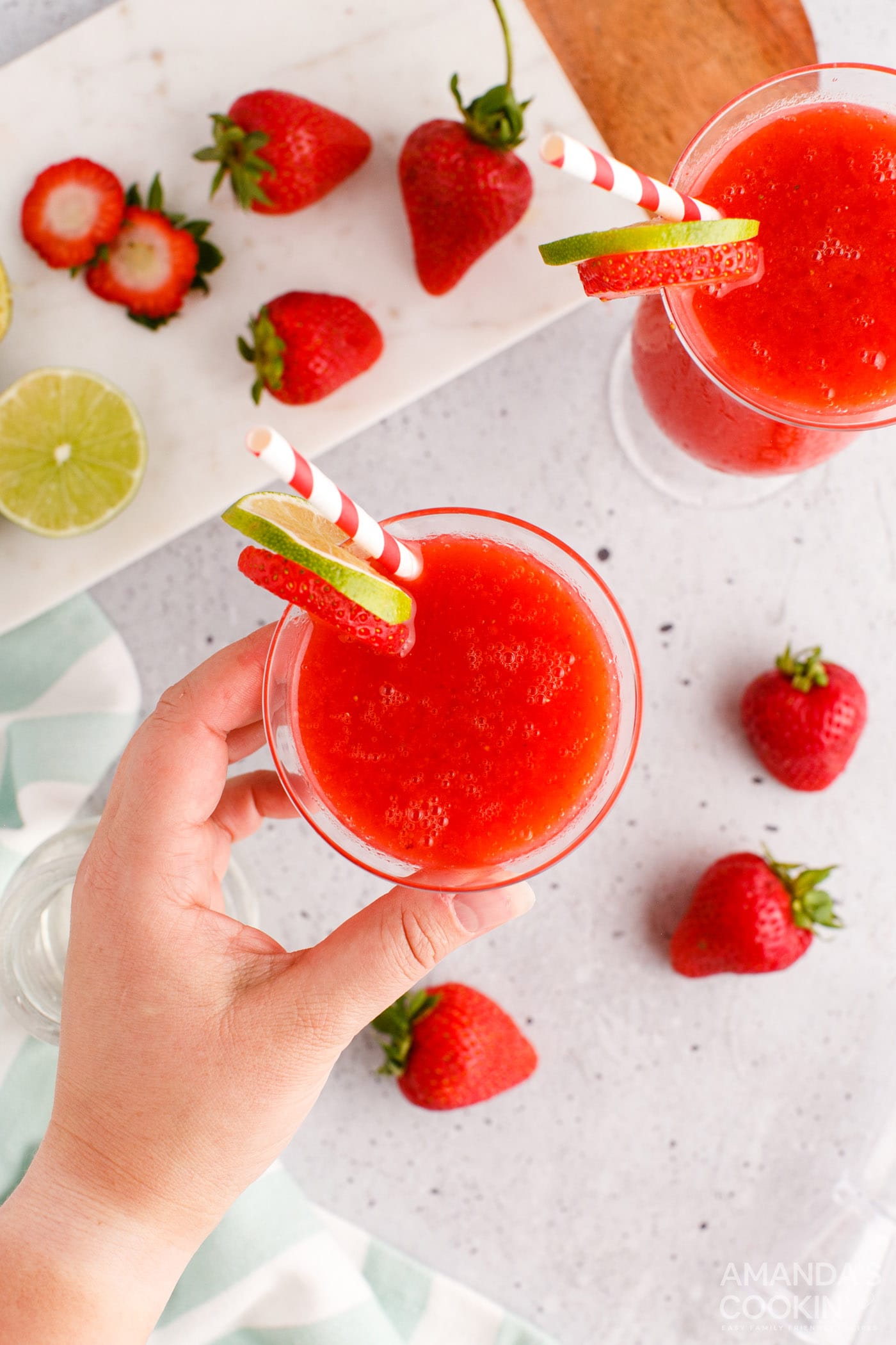 hand reaching for a Strawberry Daiquiri