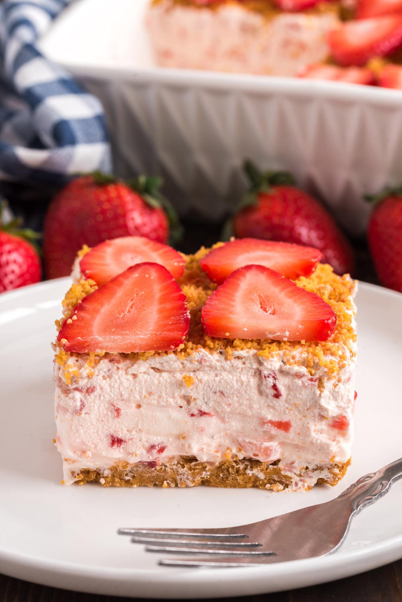 Slice of Strawberry Dream Dessert on a plate with a fork