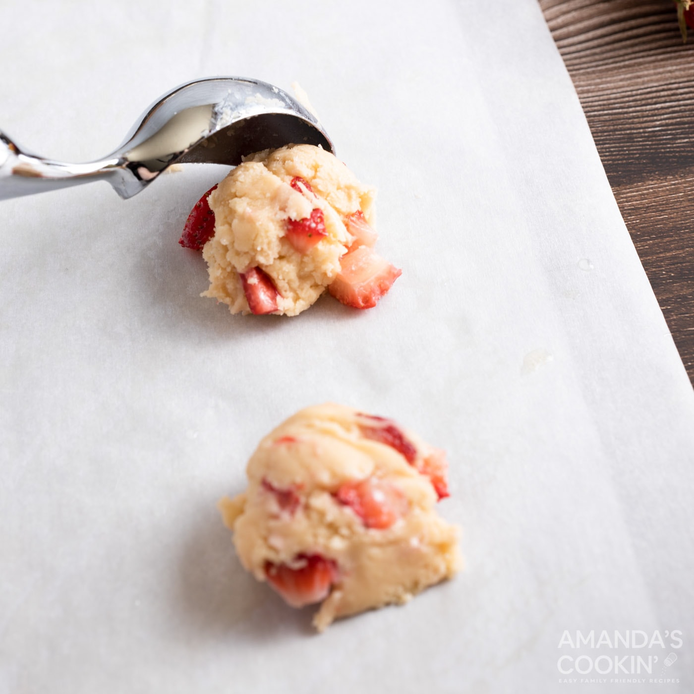 scooping cookie dough onto baking sheet