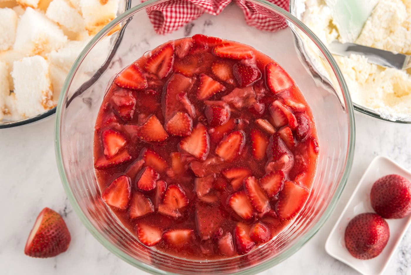 layer of macerated strawberries on top of cream cheese layer