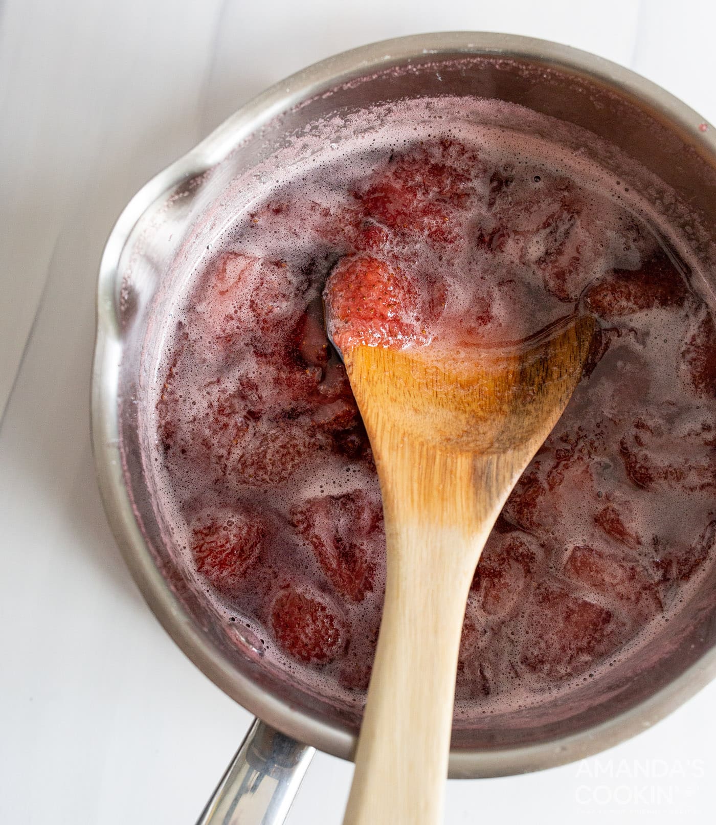 strawberry simple syrup in a saucepan