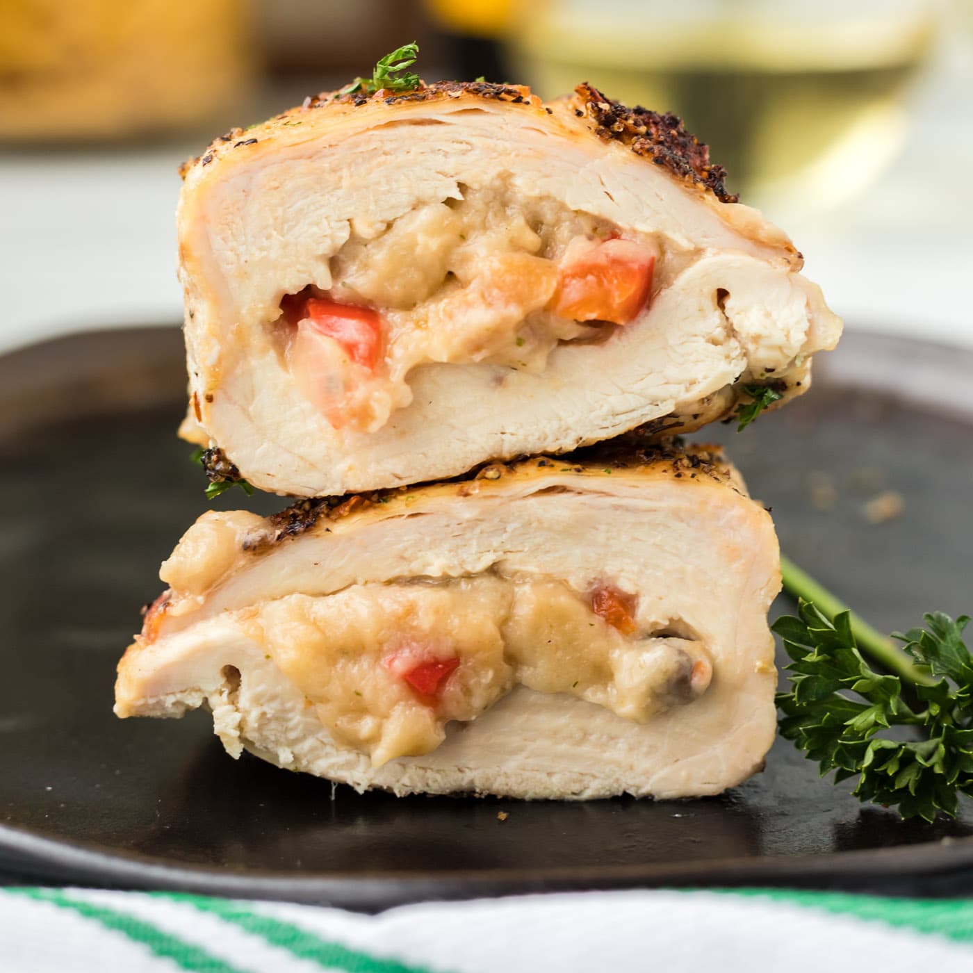 Stuffed Chicken Breast on a black plate