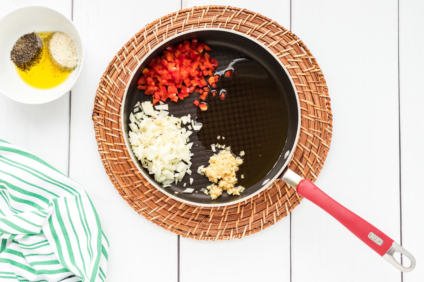 red bell pepper, garlic, and onion in a skillet witholive oil
