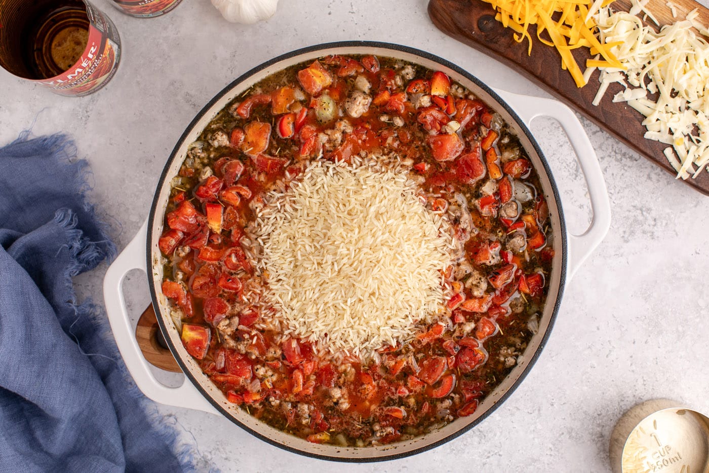 rice added to dutch oven with ground beef mixture