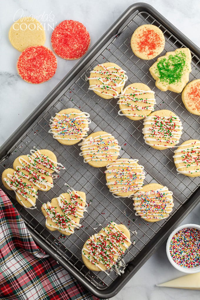 sugar cookies decorated and resting on a wire rack
