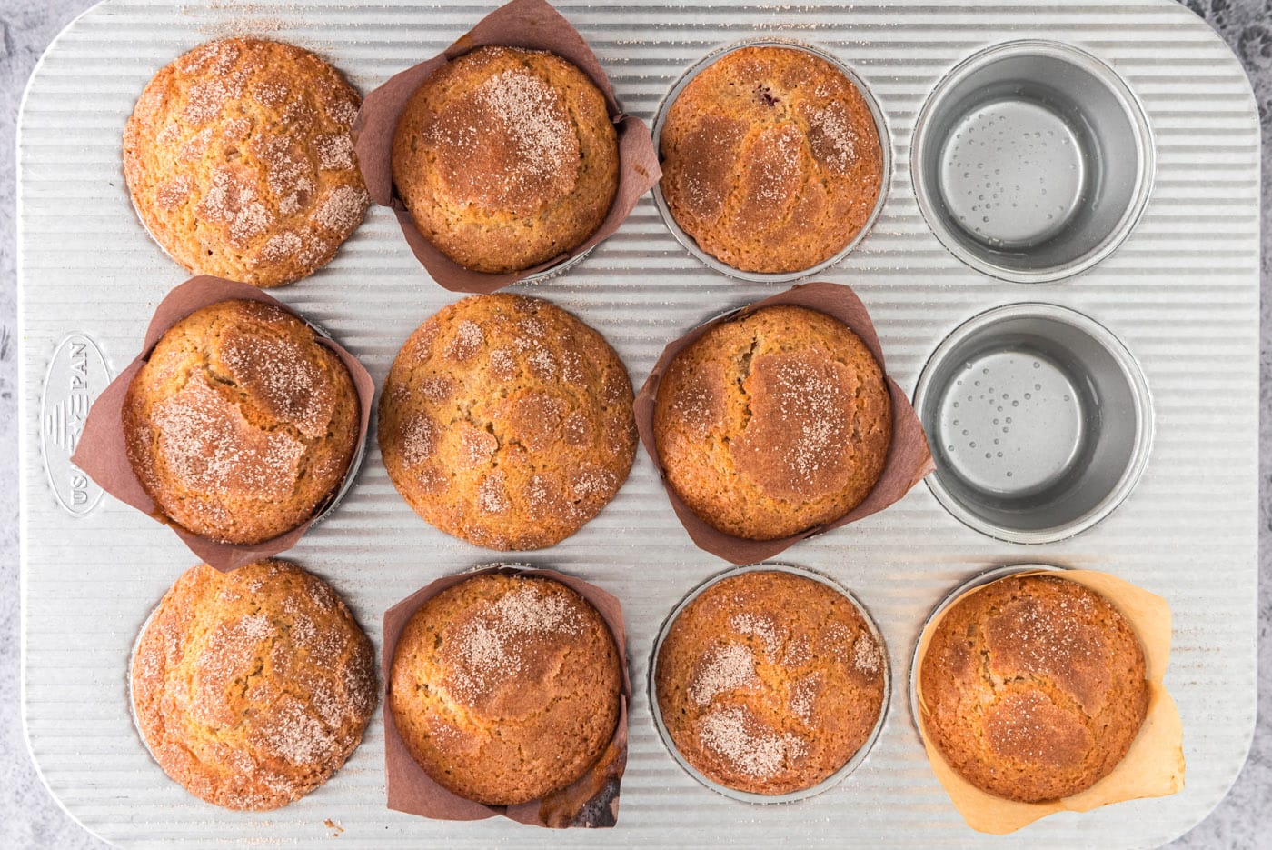 plum muffins topped with cinnamon sugar