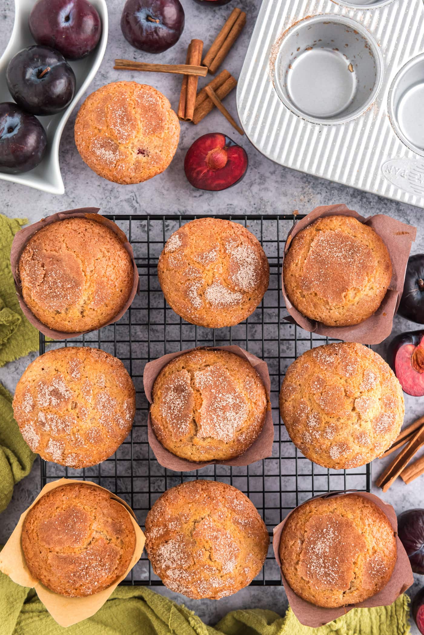 Sugar Crusted Plum Muffins resting on a wire rack
