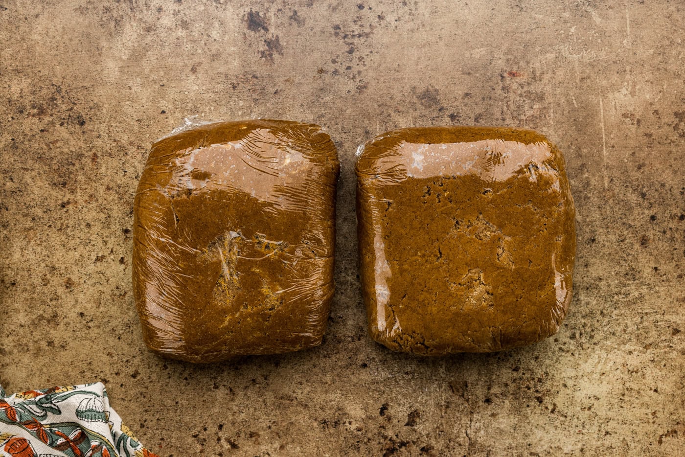 molasses spice cookie dough halved and wrapped in plastic wrap