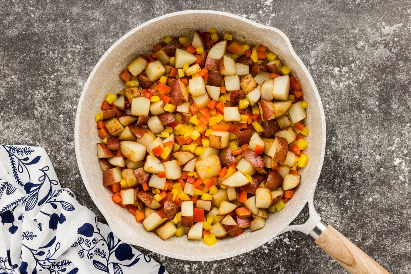 sausage with peppers and potatoes in a skillet