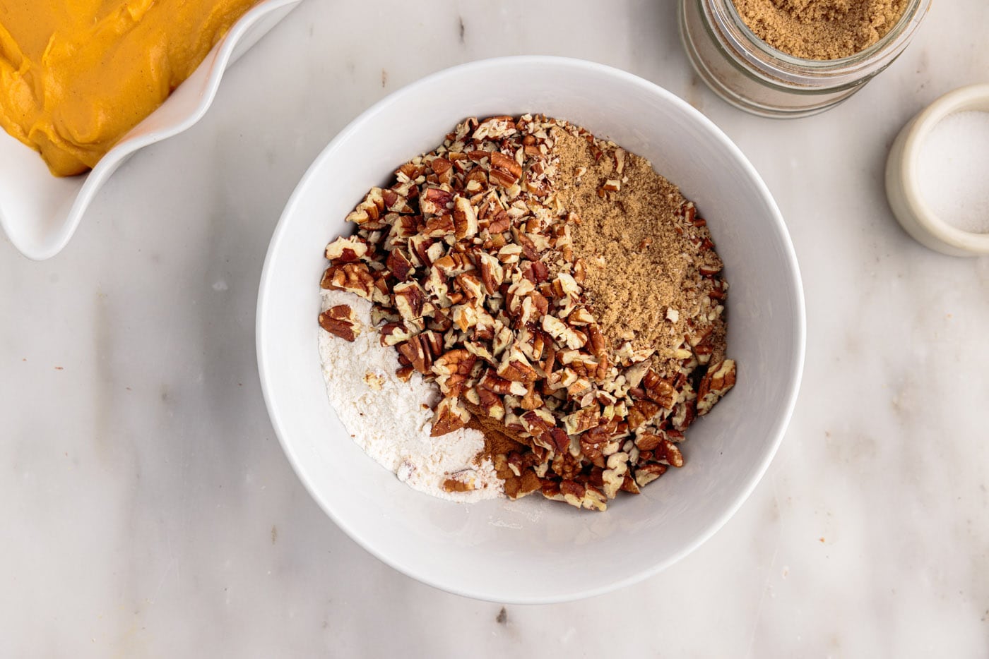 pecans, brown sugar, and flour in a bowl