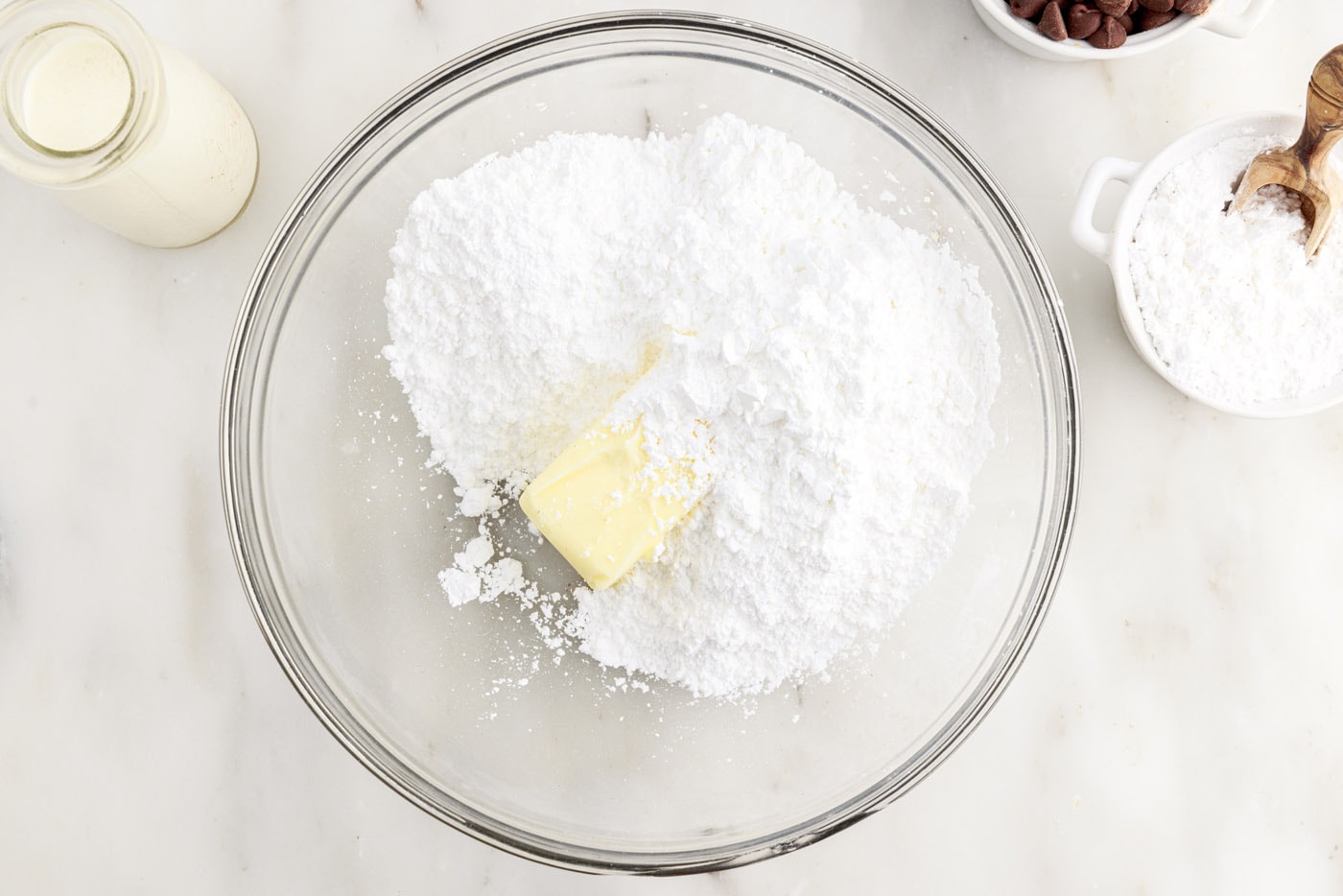 butter and powdered sugar in a bowl