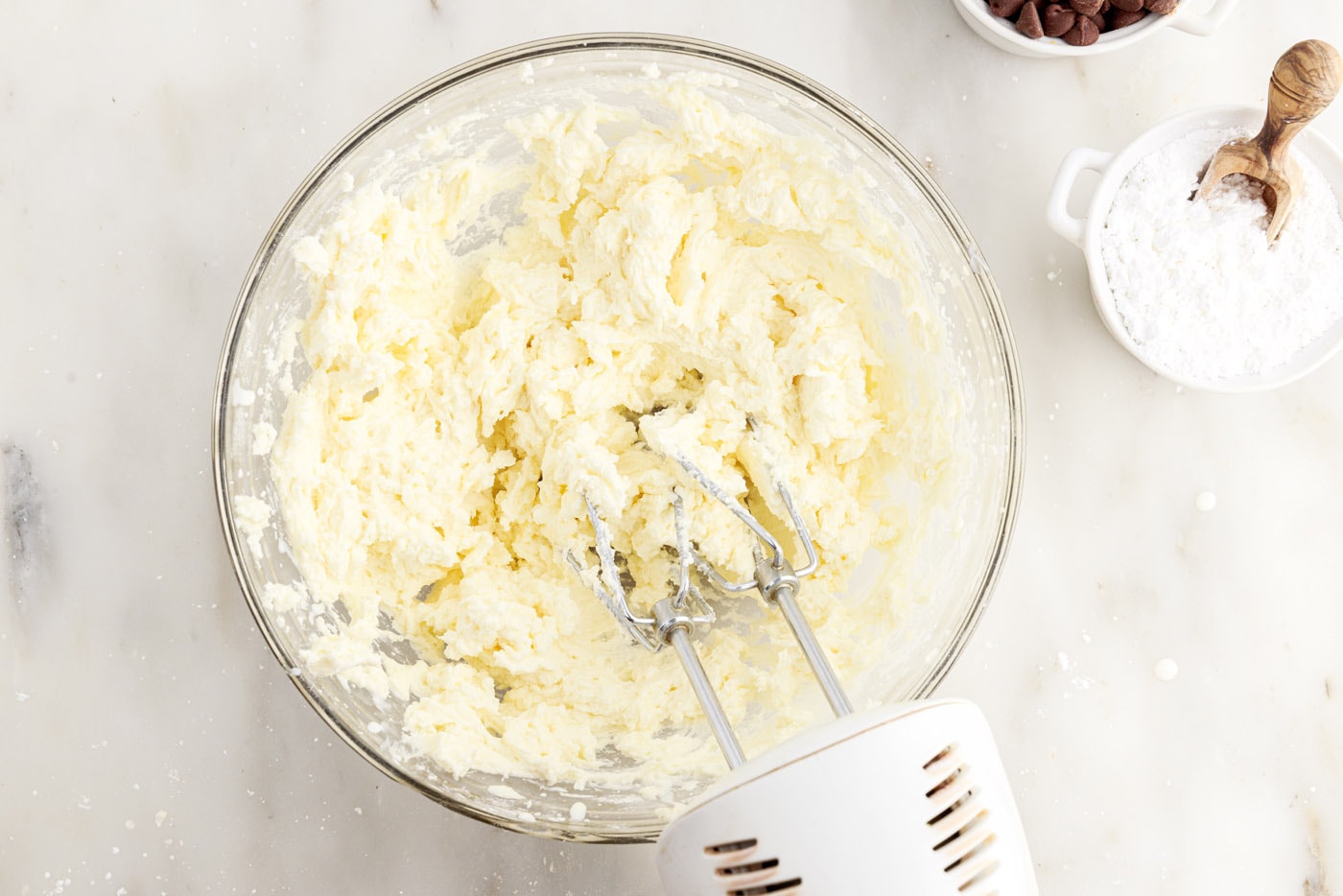 beating buttercream with a hand mixer