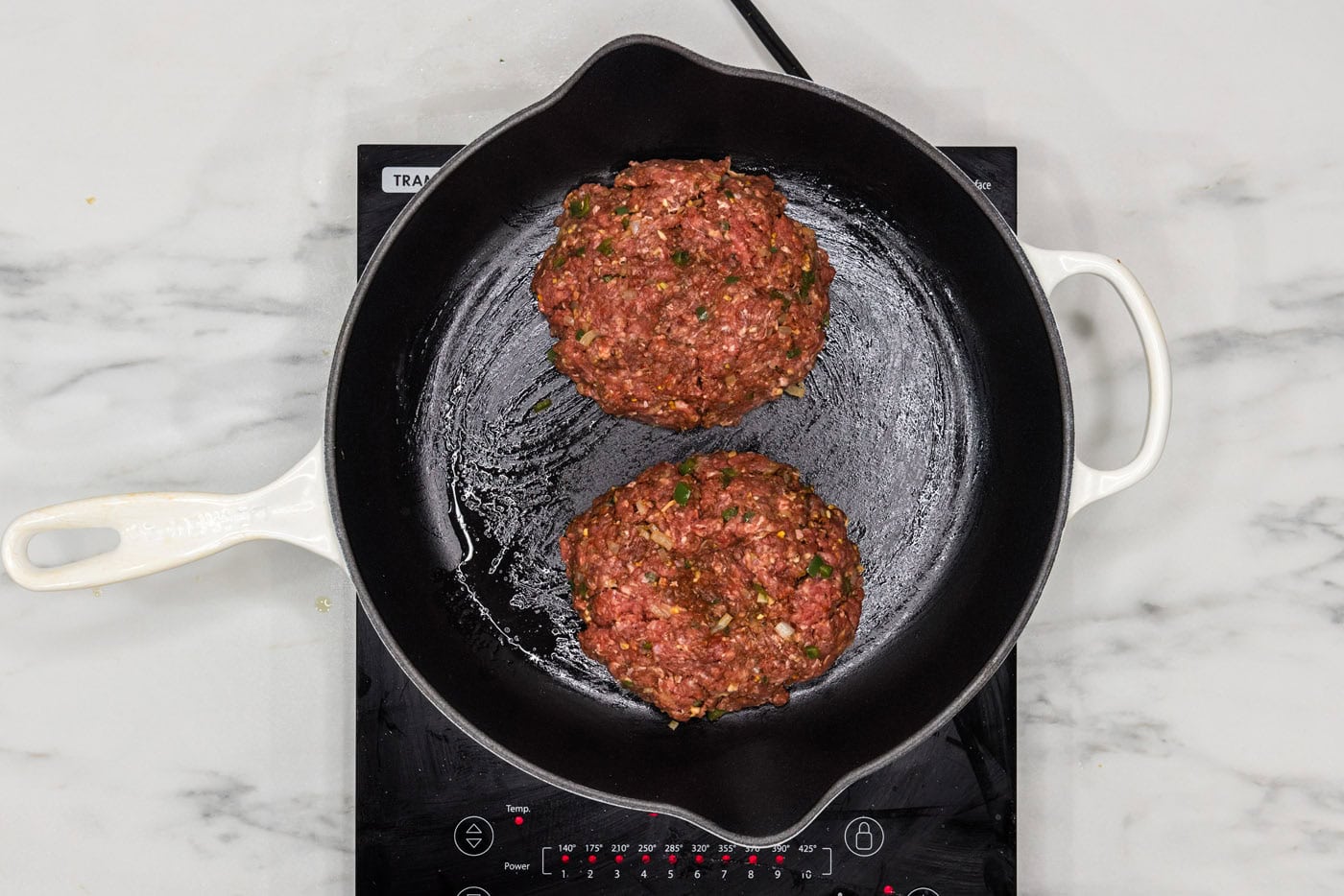 burger patties in a skillet