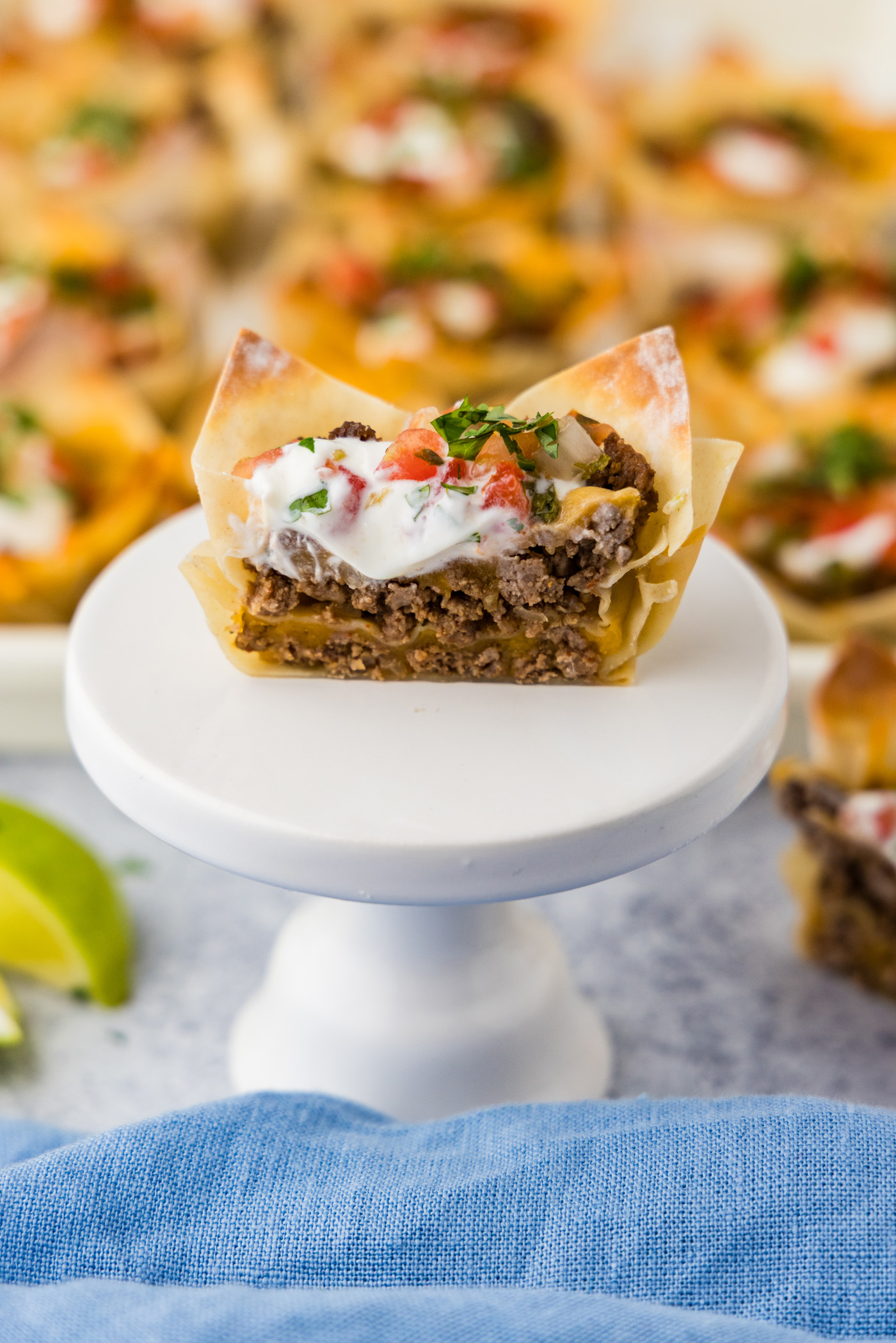 Taco Cup cut in half resting on a cupcake stand