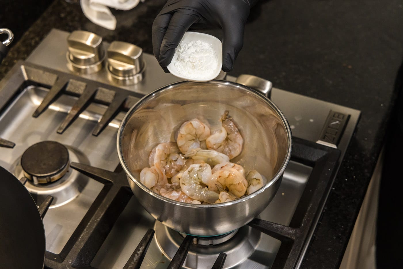 adding cornstarch to shrimp