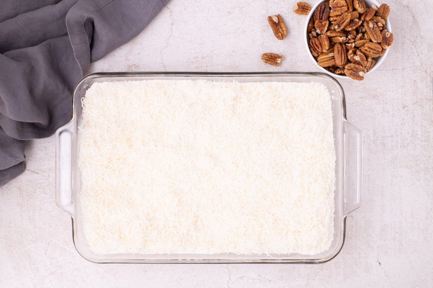 shredded coconut on top of powdered cake mix