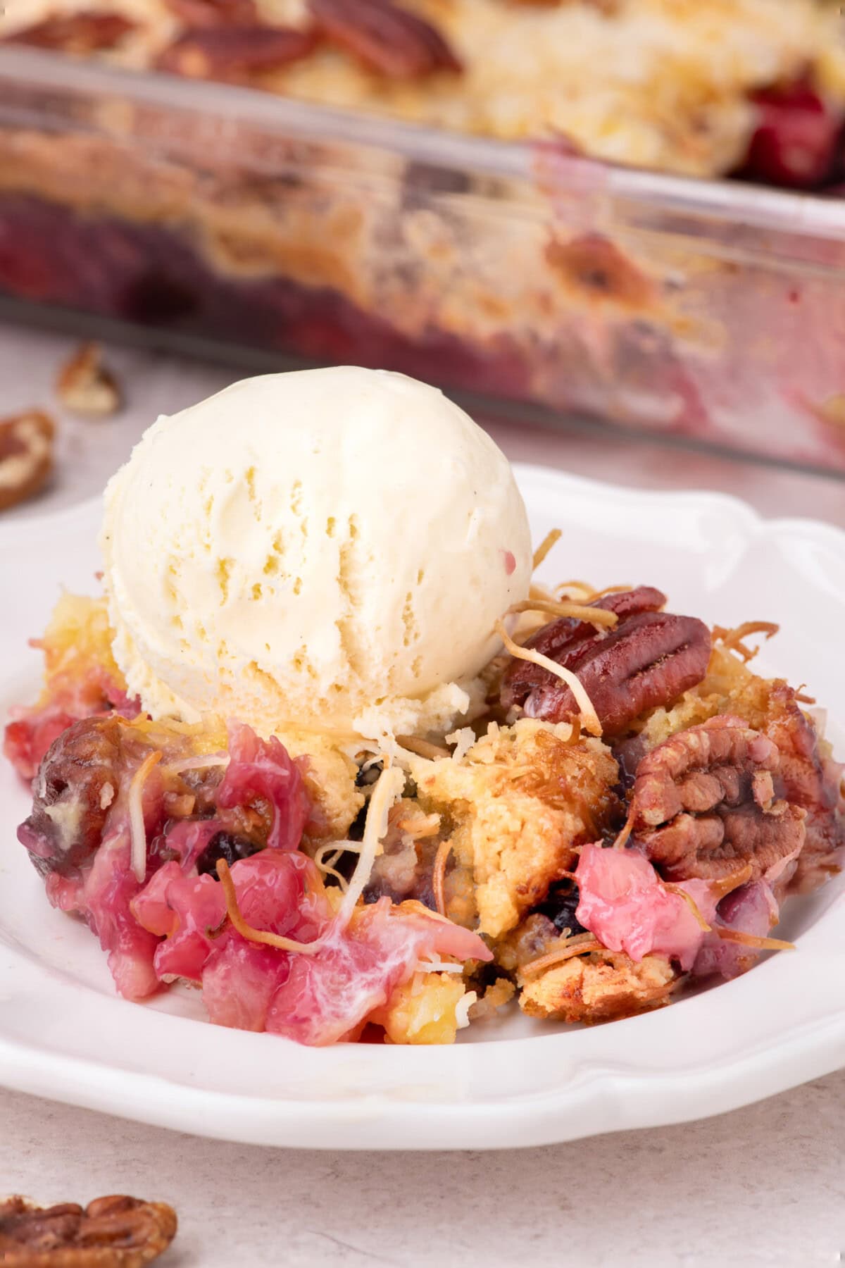 Serving of Texas Pie on a plate topped with ice cream