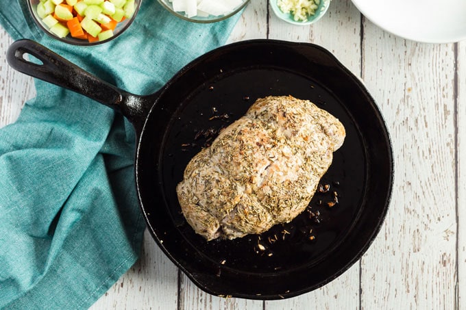 brown pork sirloin roast in cast iron skillet