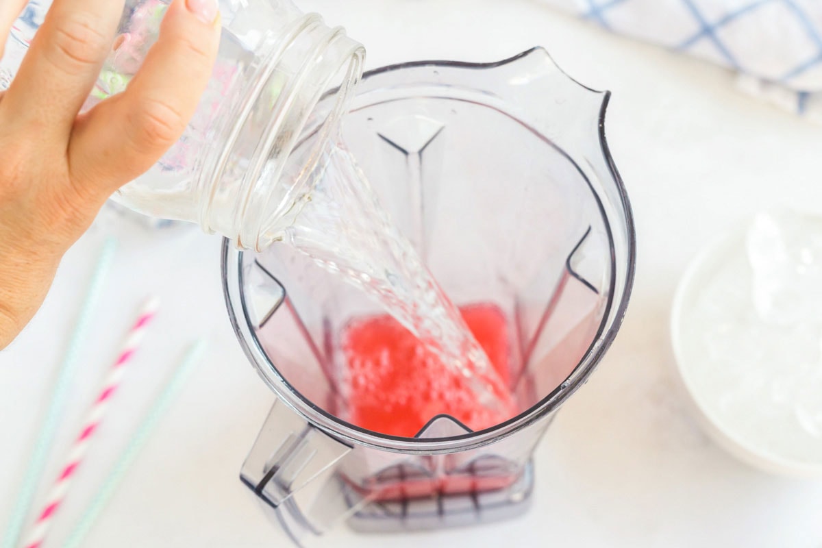 adding water to blender