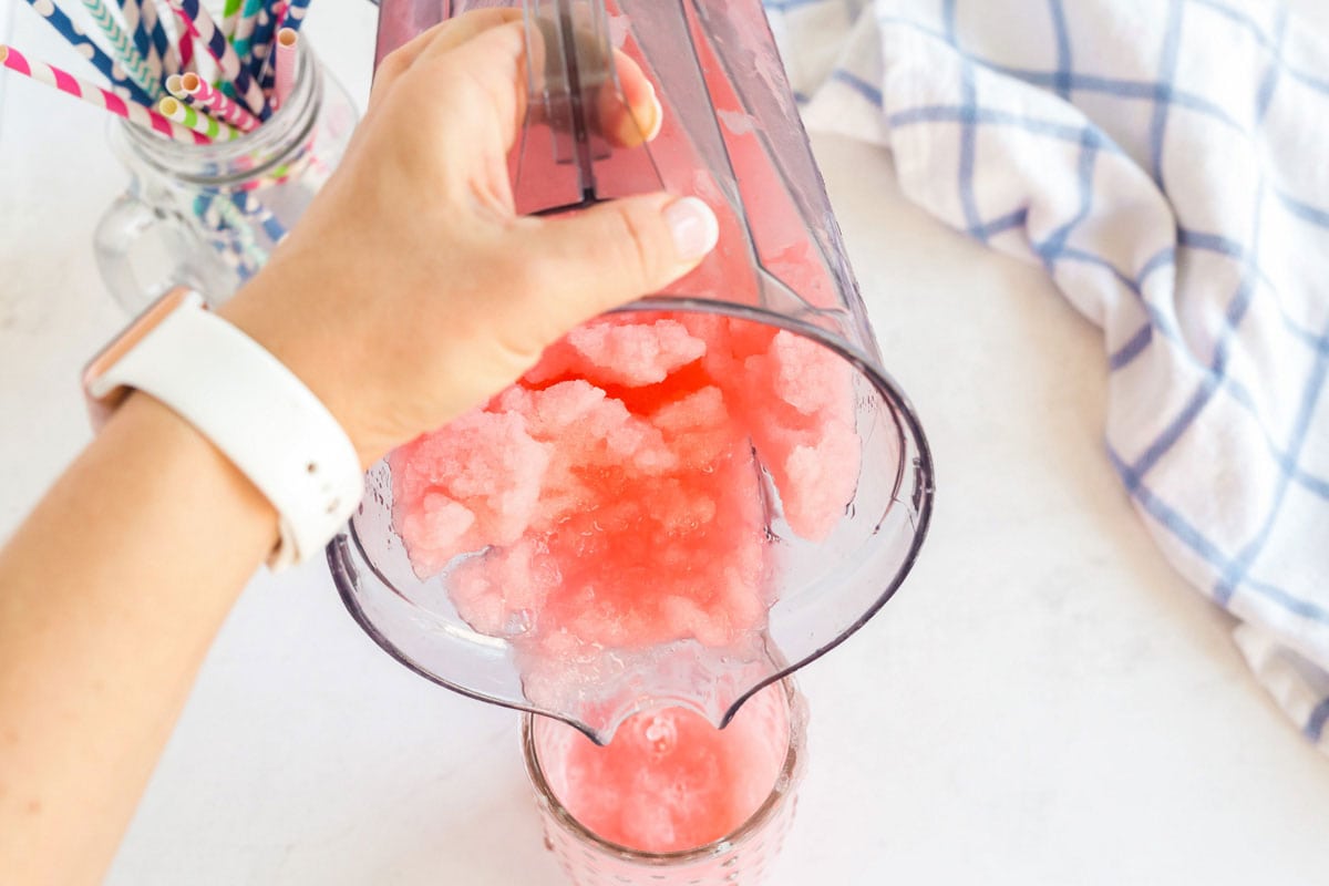 pouring slushie from blender into glass
