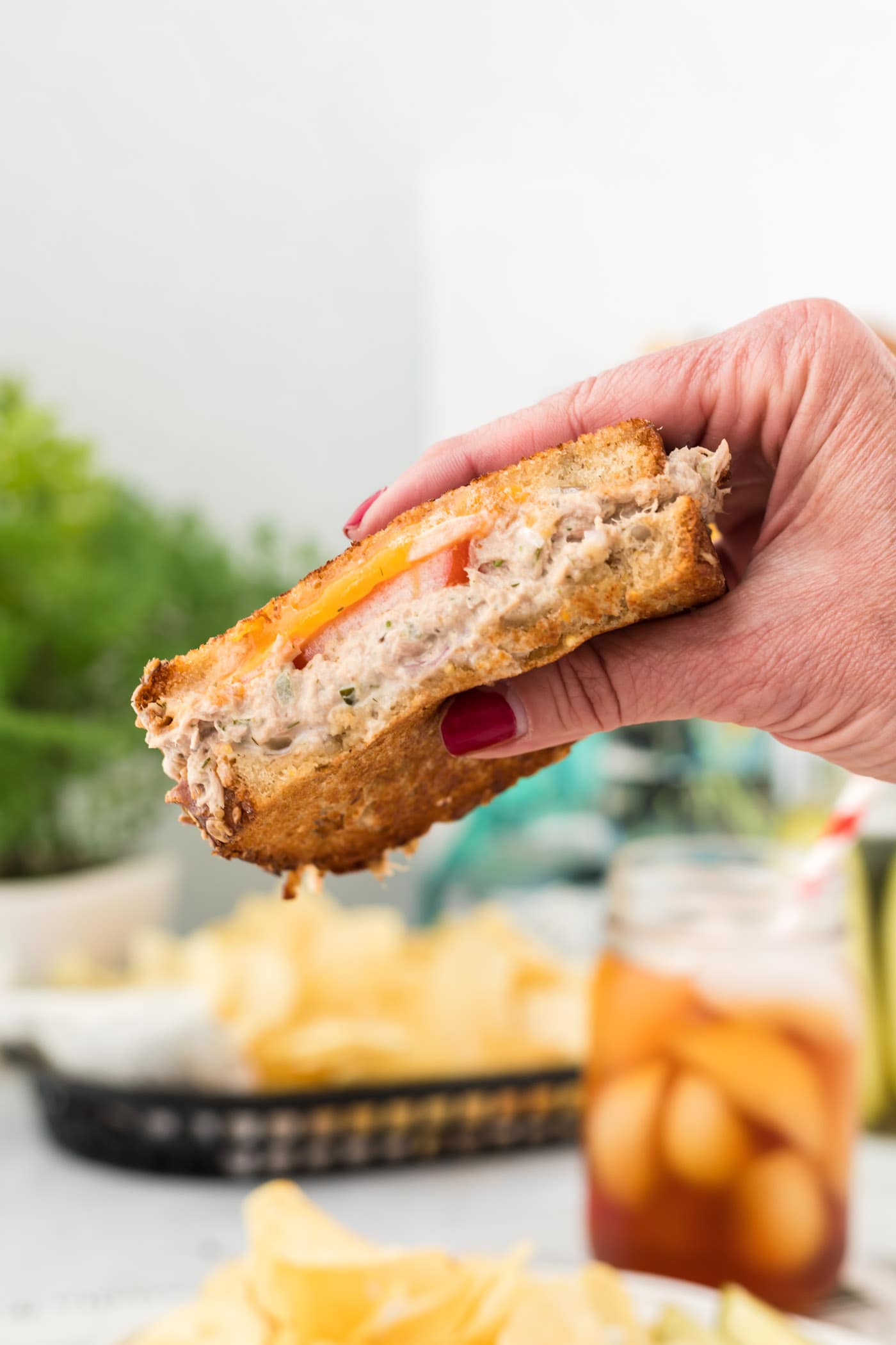 hand holding a Tuna Melt