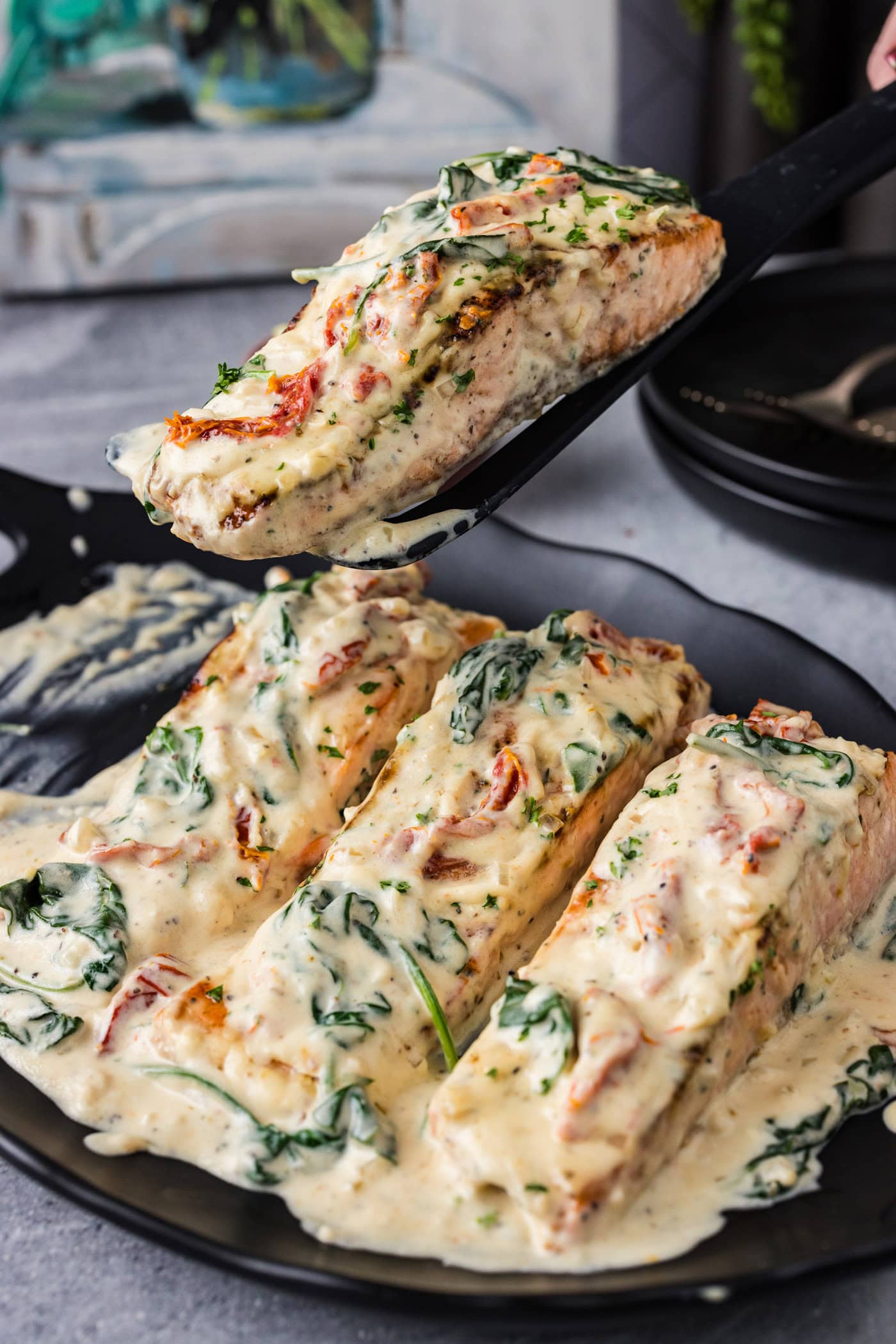 Spatula lifting up a Tuscan Salmon filet