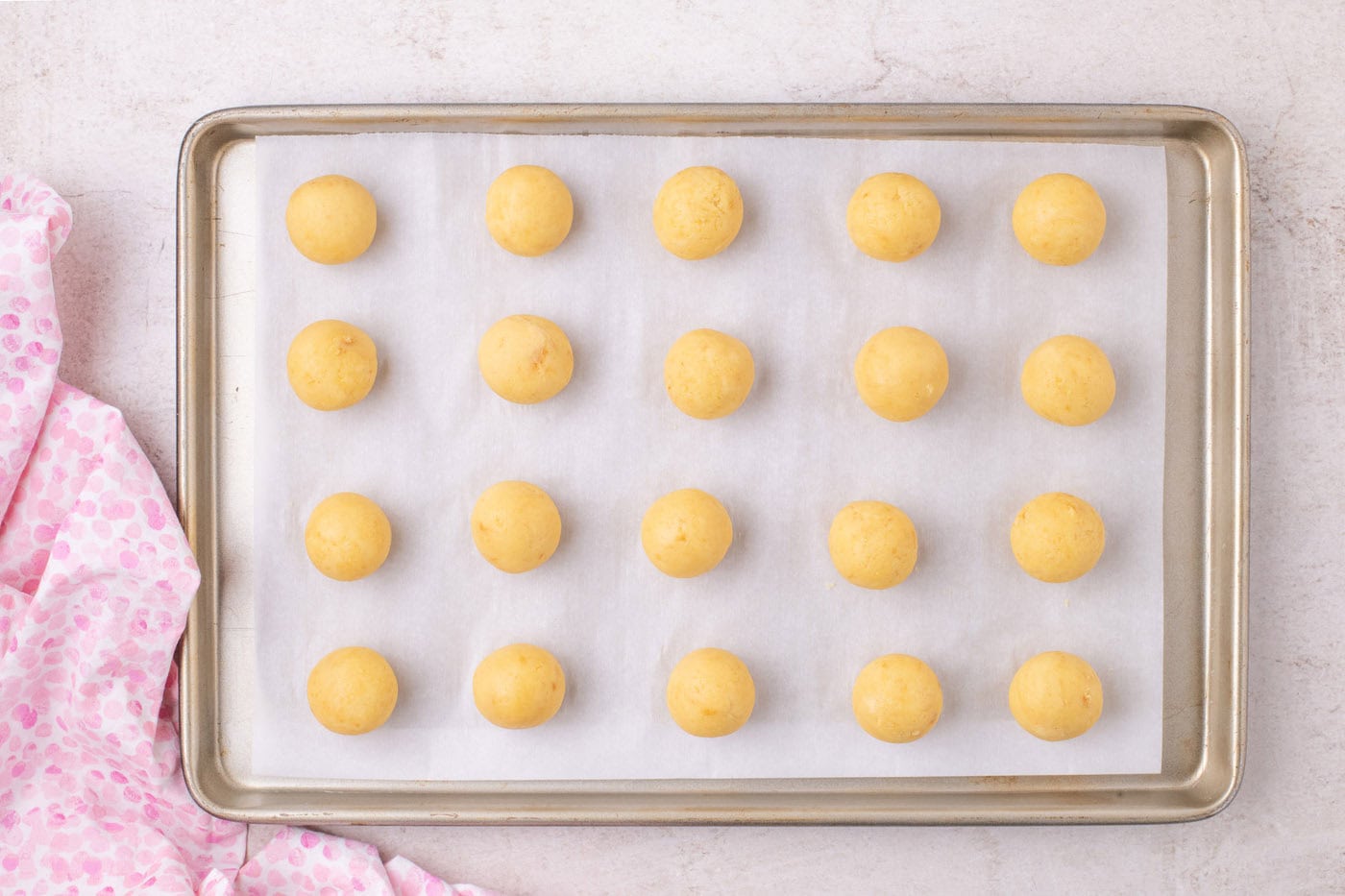rolled cake balls on a baking sheet