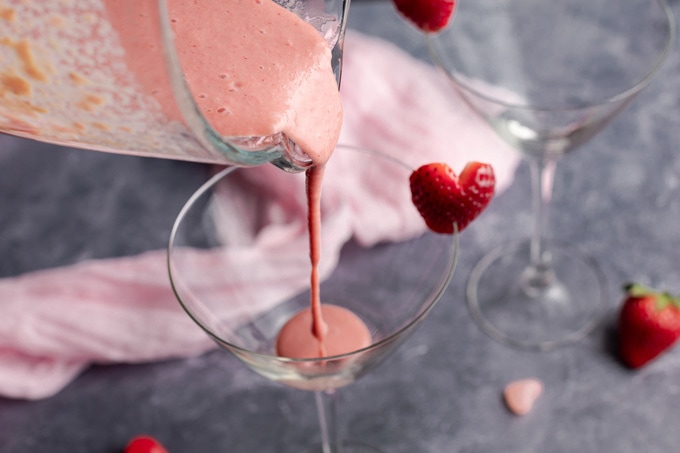 pouring strawberry mixture into glass