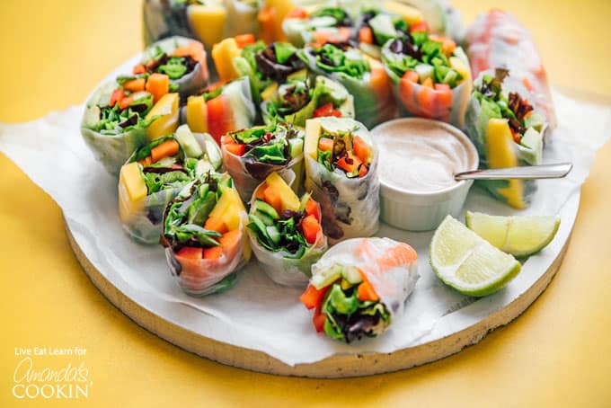 Spring rolls with veggies on a plate with dipping sauce
