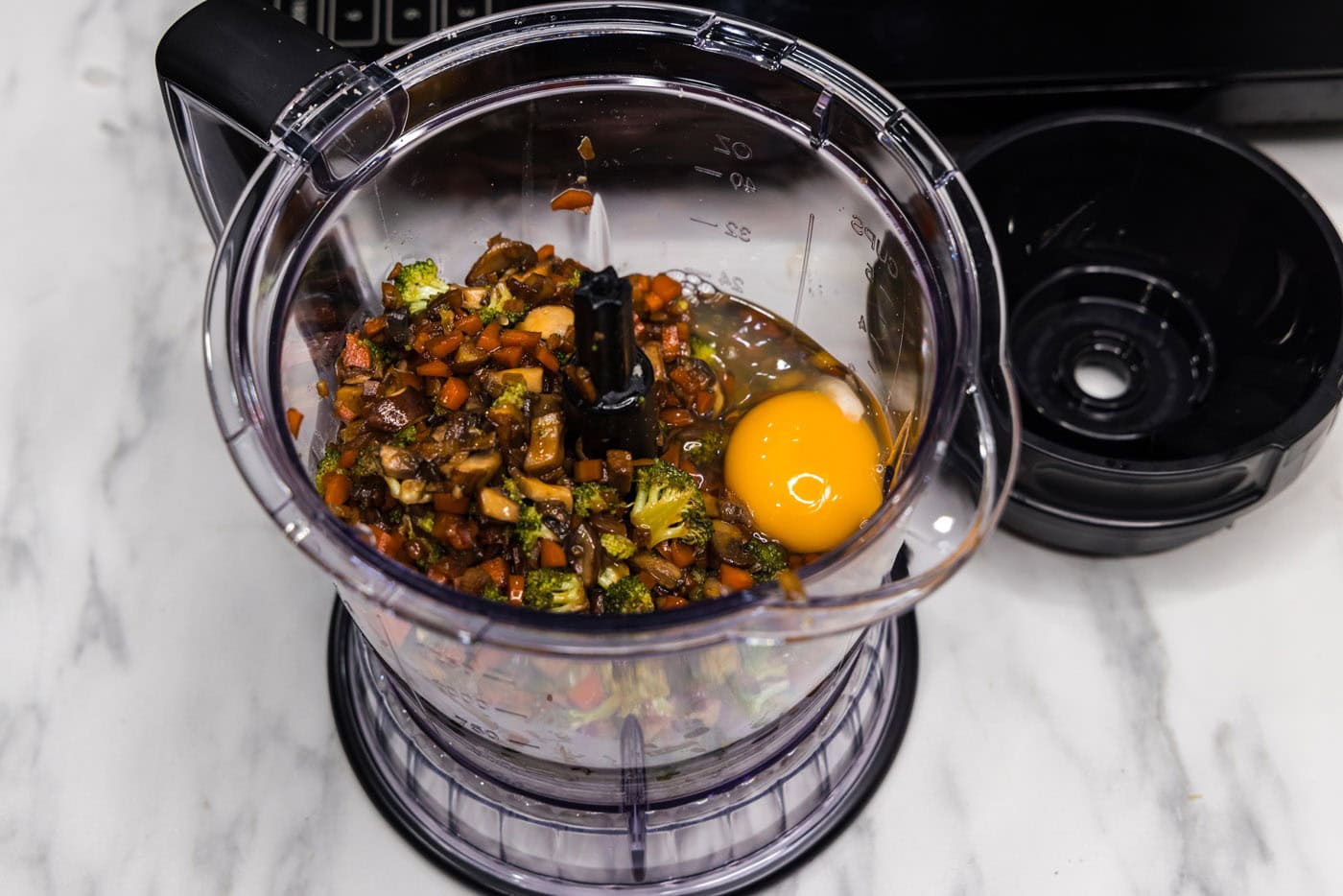 eggs and vegetable mixture in a food processor