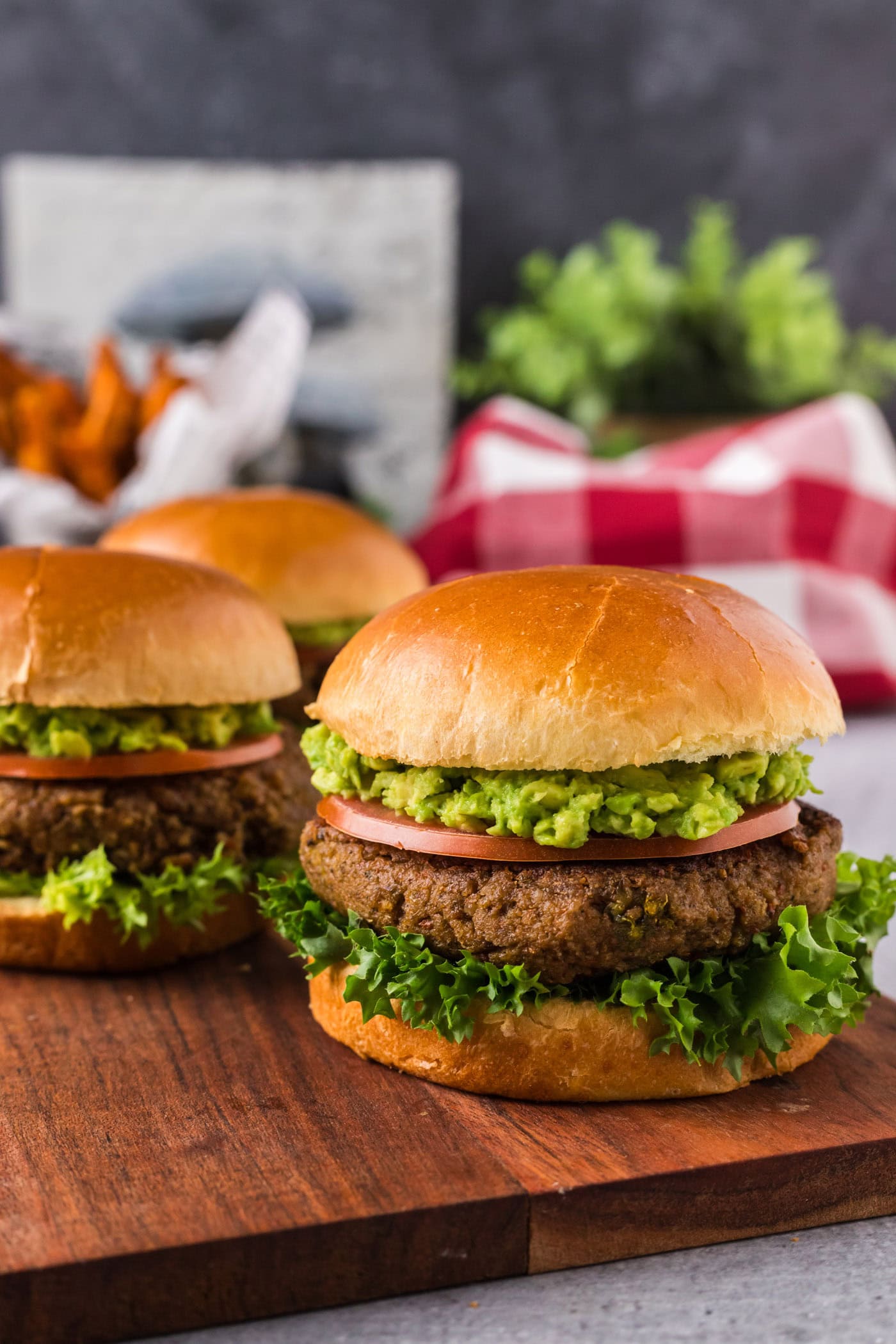 Three Veggie Burgers on a wooden serving platter