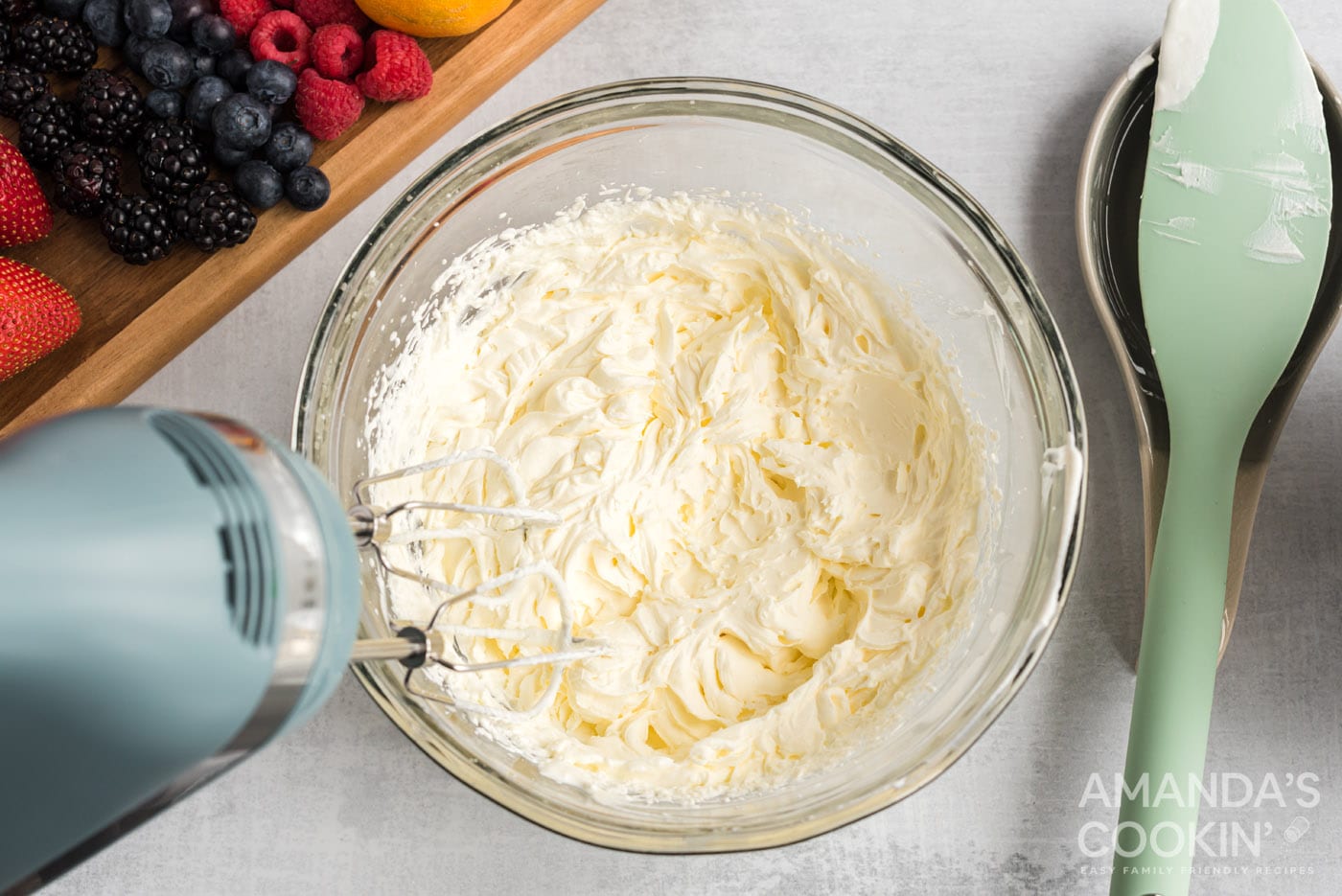 hand mixer beating cream cheese mixture