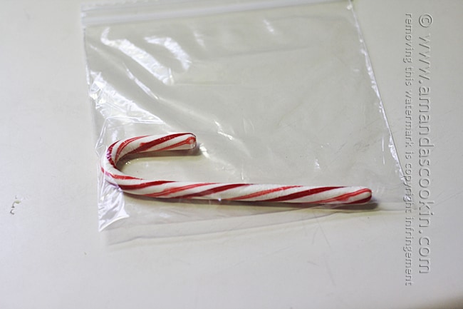A photo of a candy cane in a clear bag.