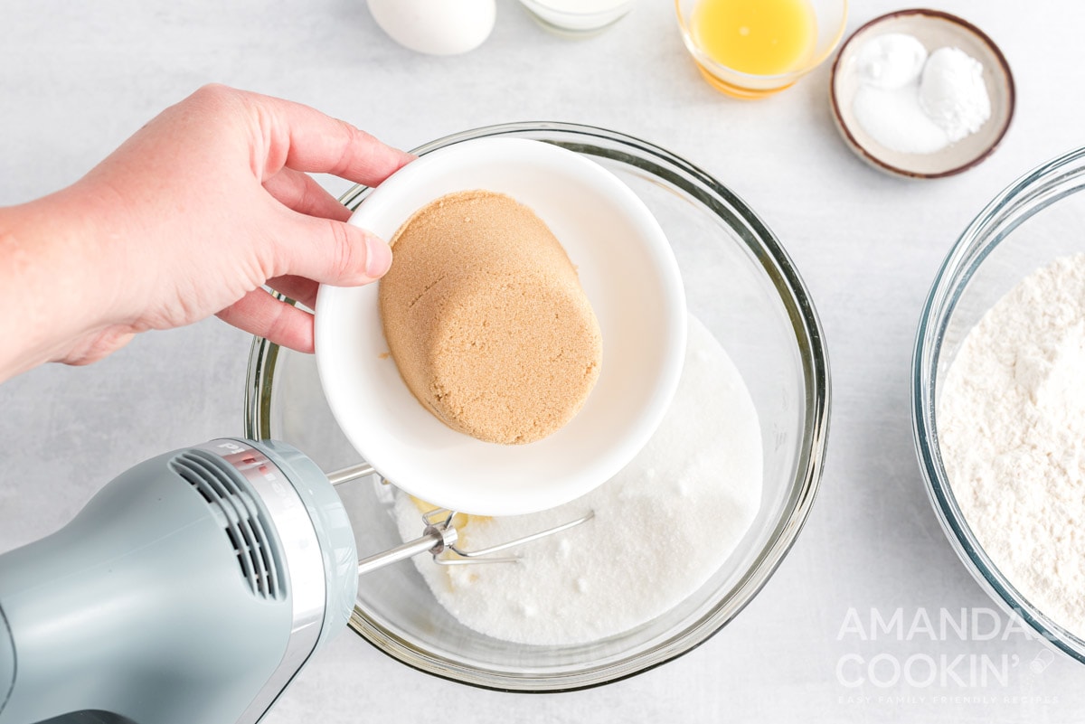 adding brown sugar to bowl