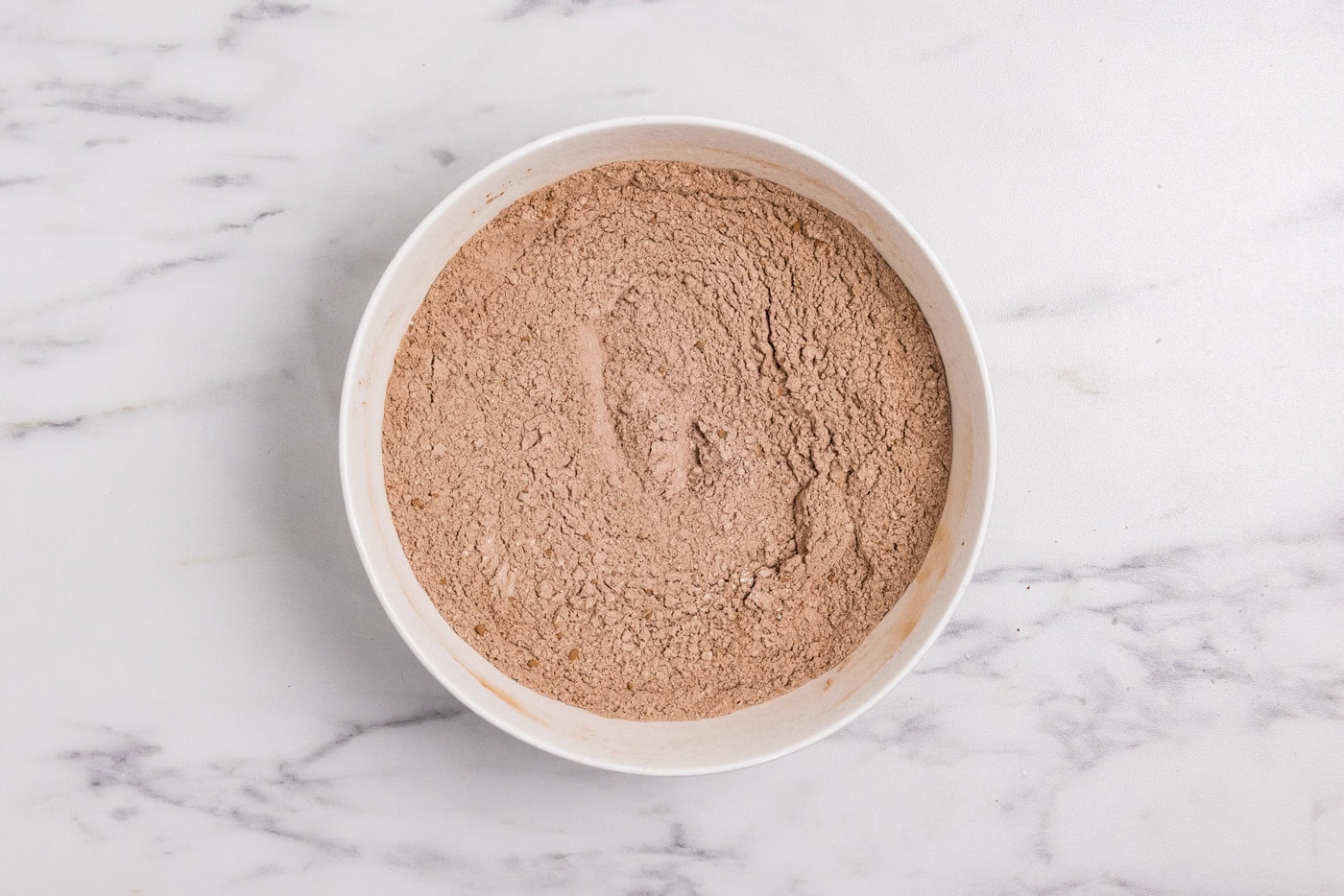 bowl of flour, cocoa powder, baking soda, and salt whisked