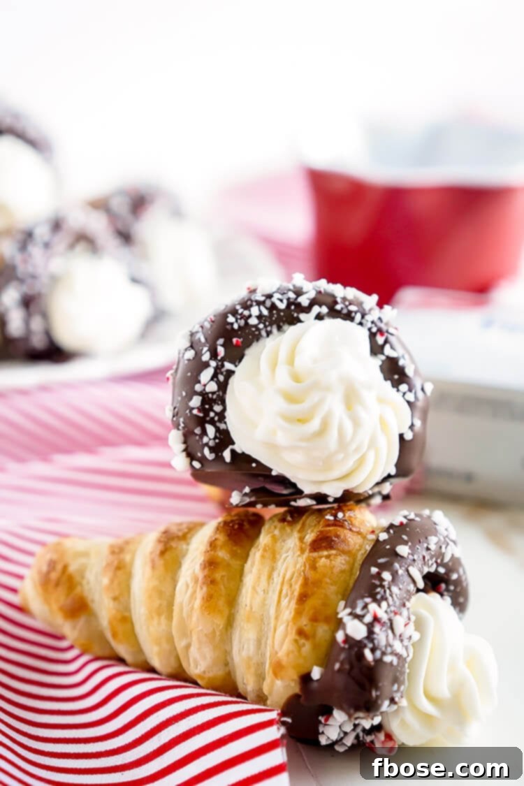 Flaky Chocolate Peppermint Cheesecake Cream Horns dipped in chocolate and crushed peppermint.