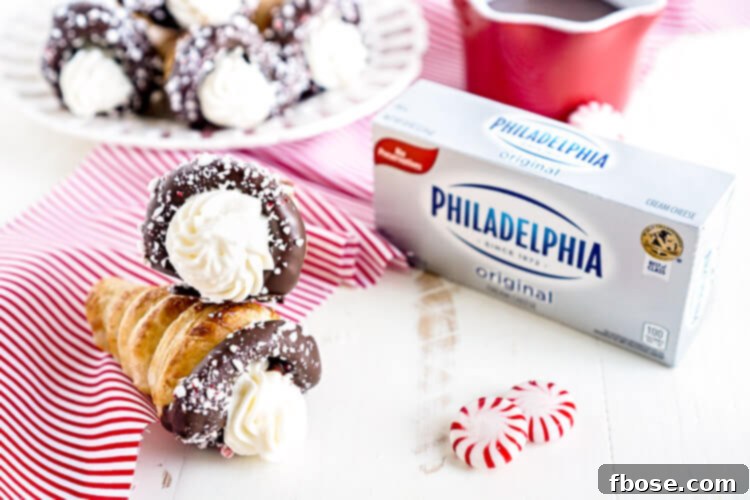 Close-up of a perfectly baked cream horn with a peppermint cream cheese swirl.