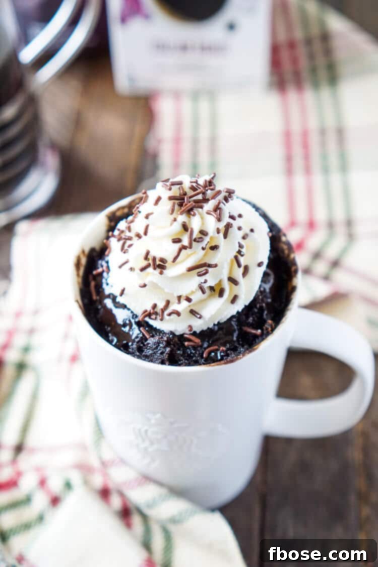 A beautifully presented Coffee Mug Cake, rich and bold, prepared in under 5 minutes, featuring inviting coffee, chocolate, and sugar notes.