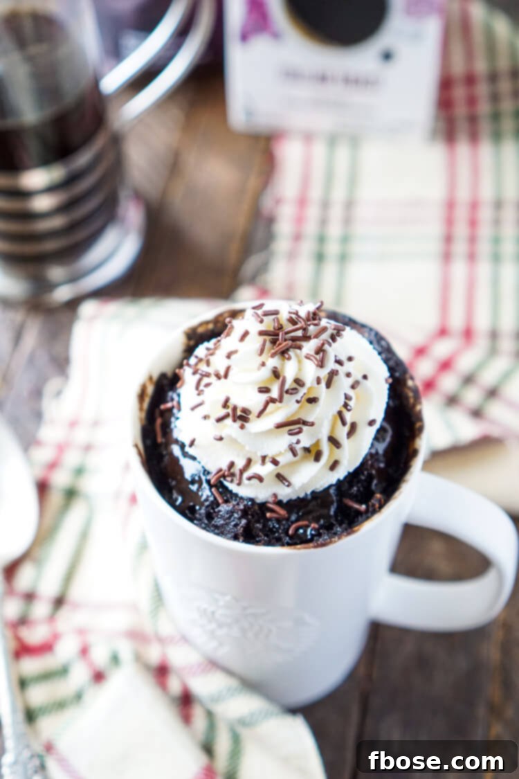 A warm, freshly microwaved Coffee Mug Cake, steaming gently, ready for toppings.