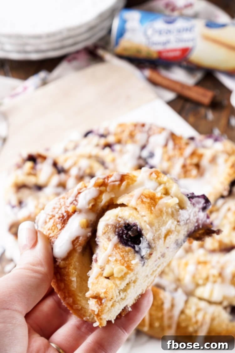 Spiced Blueberry Cream Cheese Twirl 9 This Blueberry Spice Cream Cheese Breakfast Ring is the perfect addition to a holiday brunch. A simple and sweet filling is wrapped up in crescent dough and topped with chopped pecans and icing for a delicious morning pastry the whole family can enjoy!