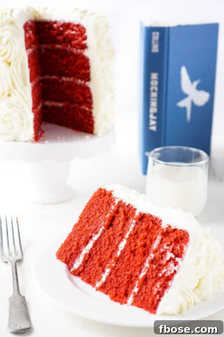 Artfully arranged Red Velvet Cake slices with creamy white frosting, capturing the essence of President Snow's White Rose motif and the intensity of The Hunger Games.