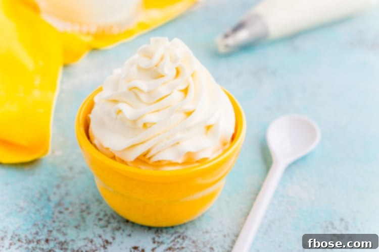 This Cream Cheese Whipped Cream is deliciously creamy and tangy topping for desserts, milkshakes, hot chocolate, and more! Made with just 4 ingredients and ready in 5 minutes!