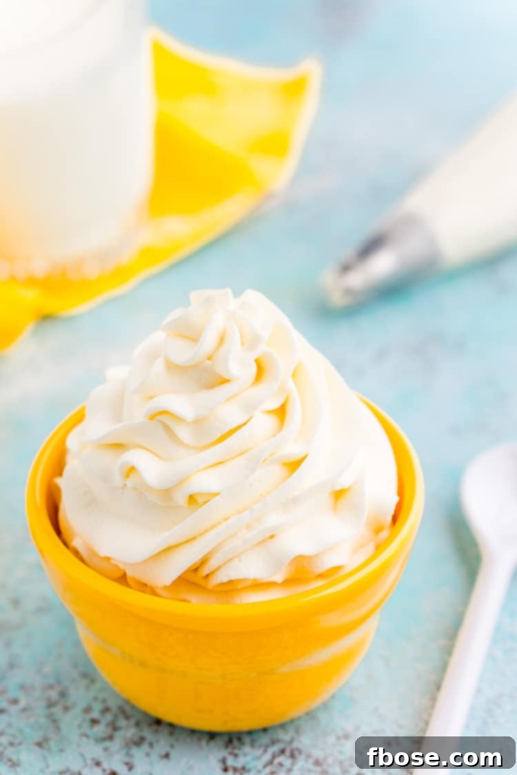 This Cream Cheese Whipped Cream is deliciously creamy and tangy topping for desserts, milkshakes, hot chocolate, and more! Made with just 4 ingredients and ready in 5 minutes!