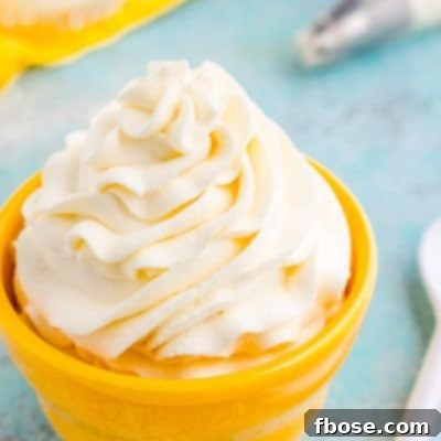 This Cream Cheese Whipped Cream is deliciously creamy and tangy topping for desserts, milkshakes, hot chocolate, and more! Made with just 4 ingredients and ready in 5 minutes!