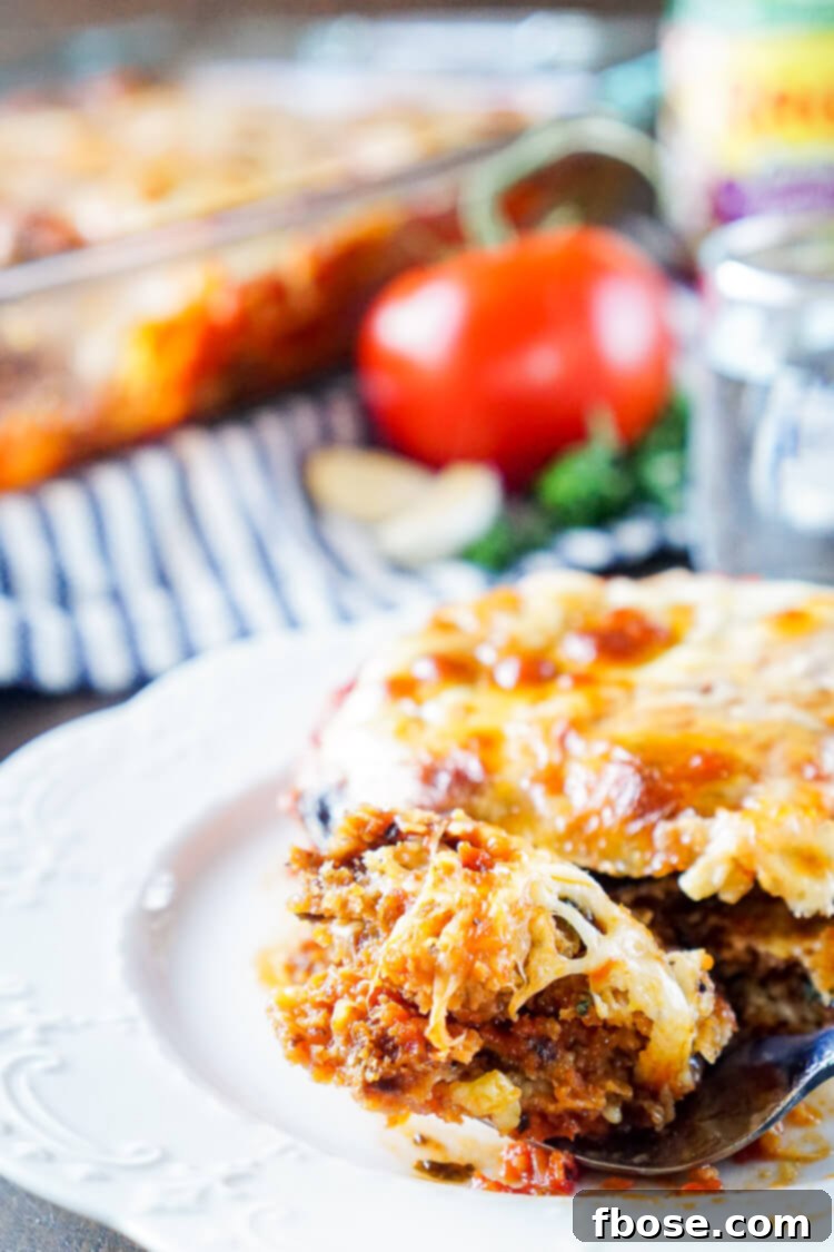 Final baked Eggplant Parmesan, golden brown and bubbling, ready to be served, a perfect representation of Italian comfort food.