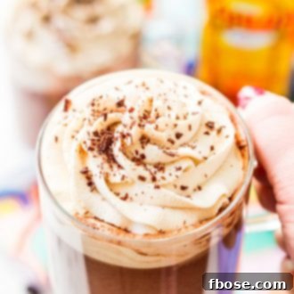 This Kahlua Hot Chocolate is so rich, creamy, and BOOZY! This hot chocolate recipe is laced with coffee liqueur and topped with a Kahlua Whipped Cream and chocolate shavings.