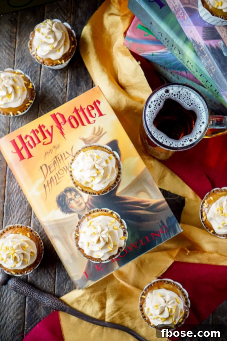 Close-up of Harry Potter Butterbeer Cupcakes arranged on a serving tray, highlighting the frosting swirls and decorative sprinkles.