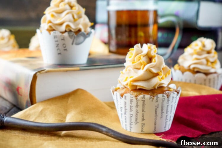 Stacked Harry Potter Butterbeer Cupcakes showcasing their inviting texture and rich butterscotch glaze.